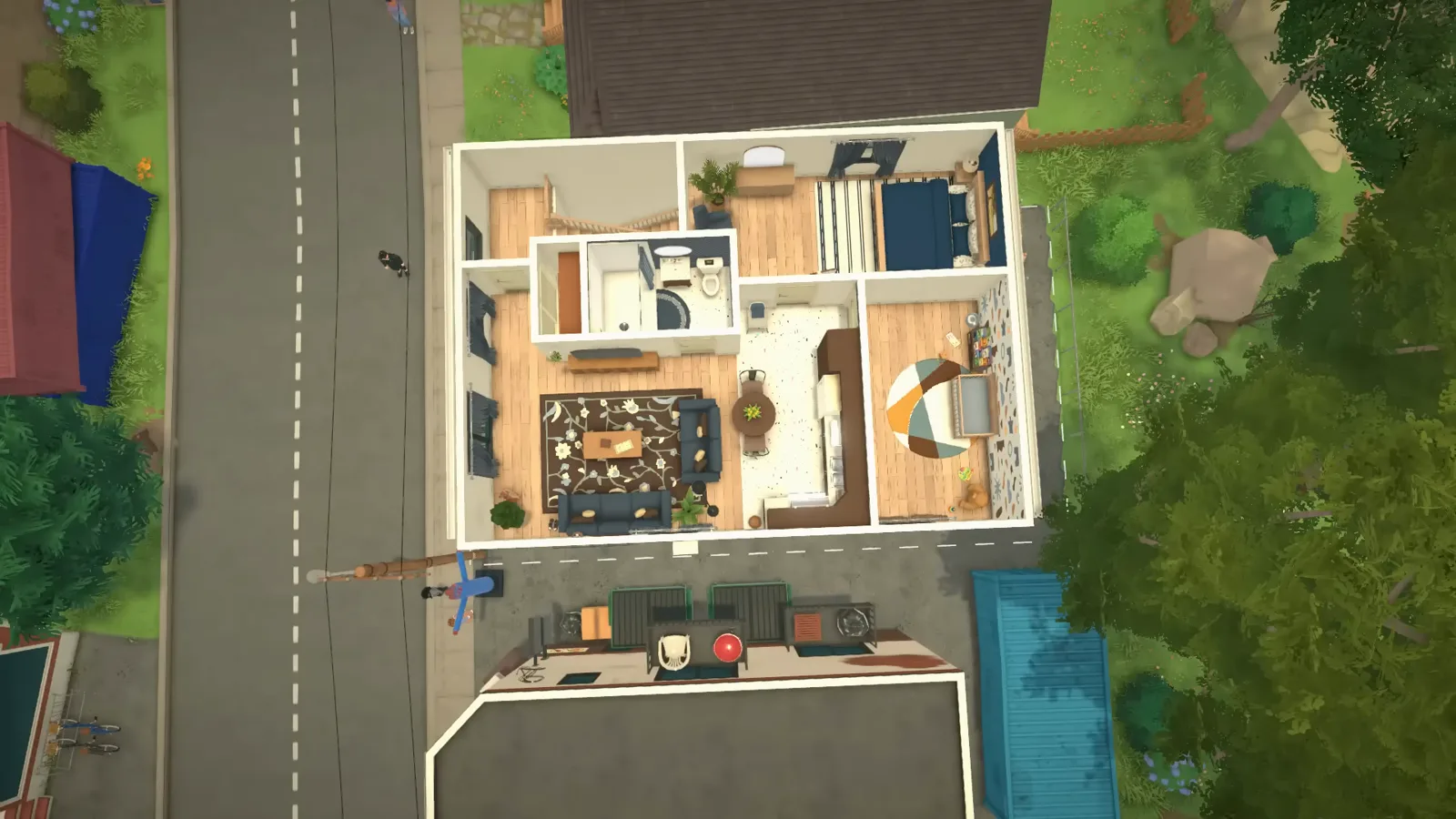 Top-down dollhouse view of a finished Paralives family apartment from above the street, showing the open-plan living zone, navy bedroom and the nursery with its shapes mural