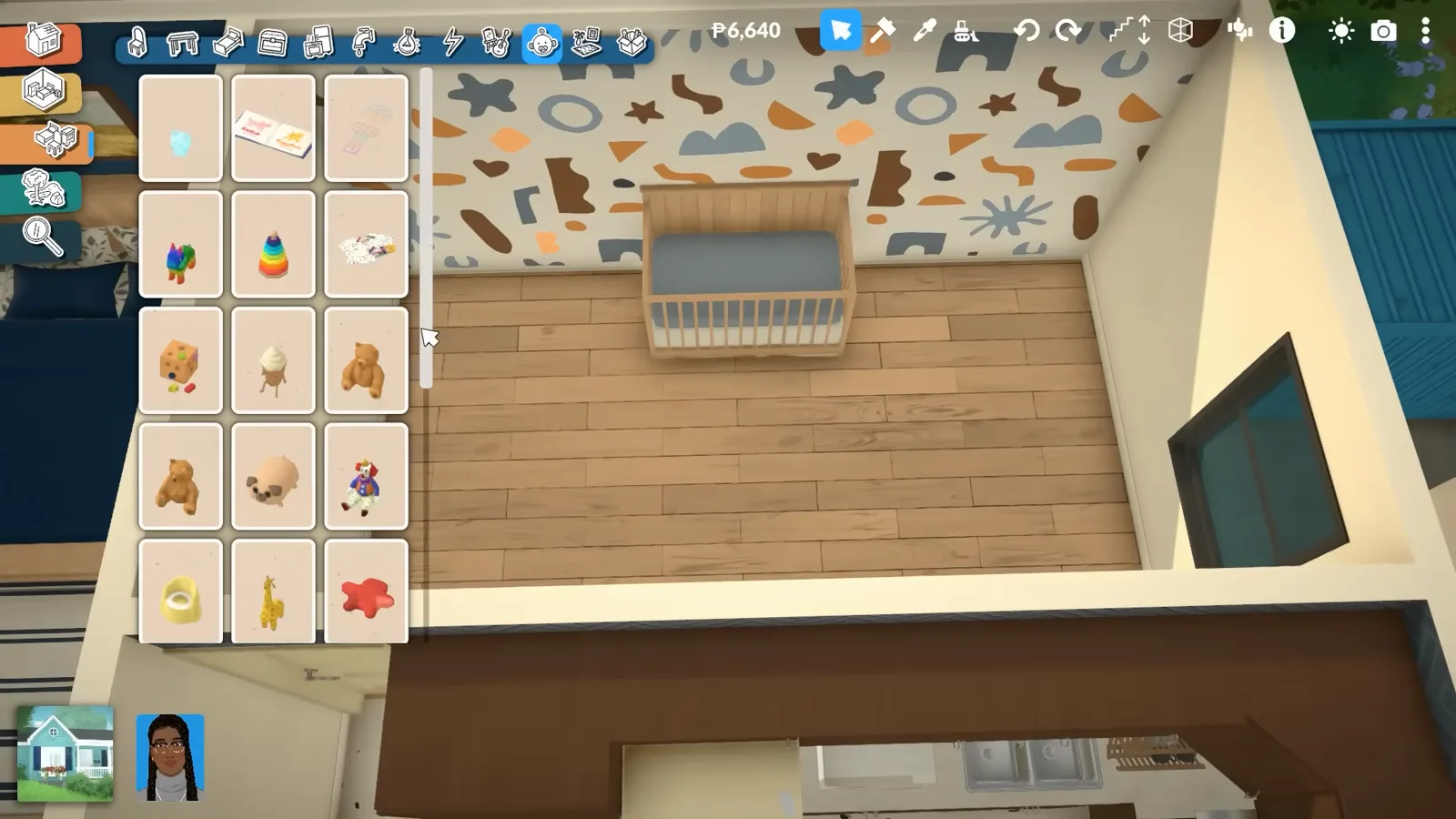 A Paralives nursery with a wooden crib against the shapes mural wall, a teddy bear and toys scattered on the floor and the toy catalogue open
