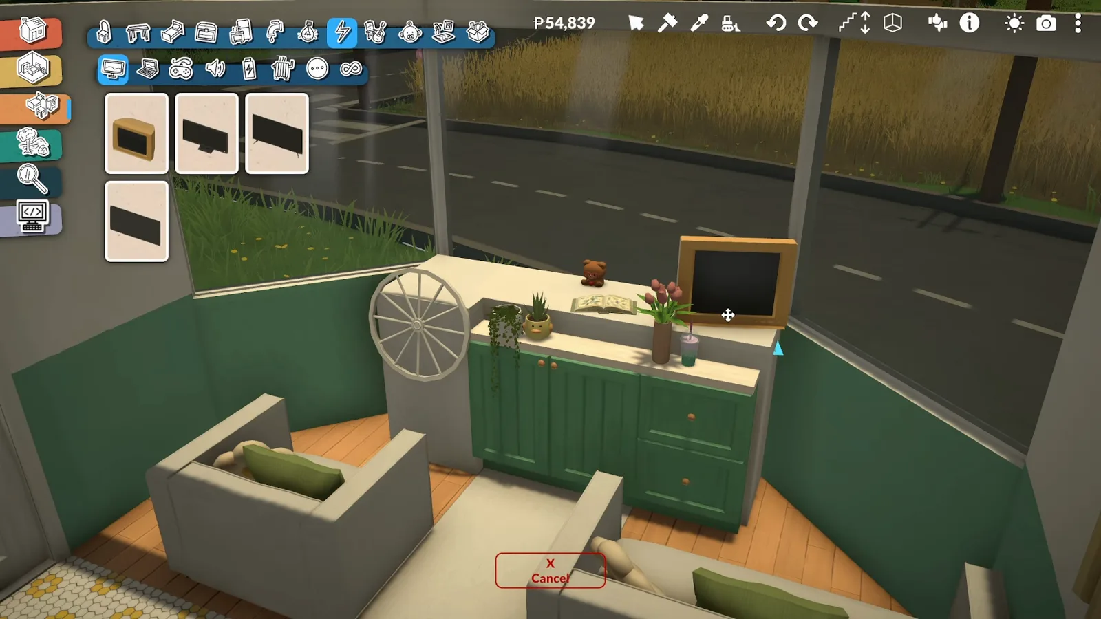 Paralives TV catalogue open as two grey sofas and a green sideboard furnish the driver's lounge at the front of the trailer, road visible through the windshield Paralives TV catalogue open as two grey sofas and a green sideboard furnish the driver's lounge at the front of the trailer, road visible through the windshield