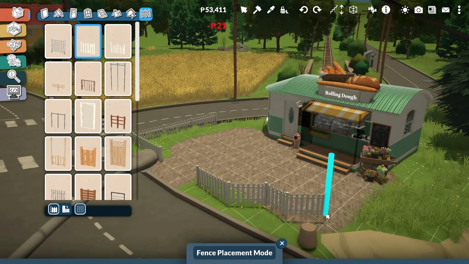 Paralives Fence Placement Mode dragging a white picket fence run across the paved courtyard in front of the finished trailer bakery Paralives Fence Placement Mode dragging a white picket fence run across the paved courtyard in front of the finished trailer bakery