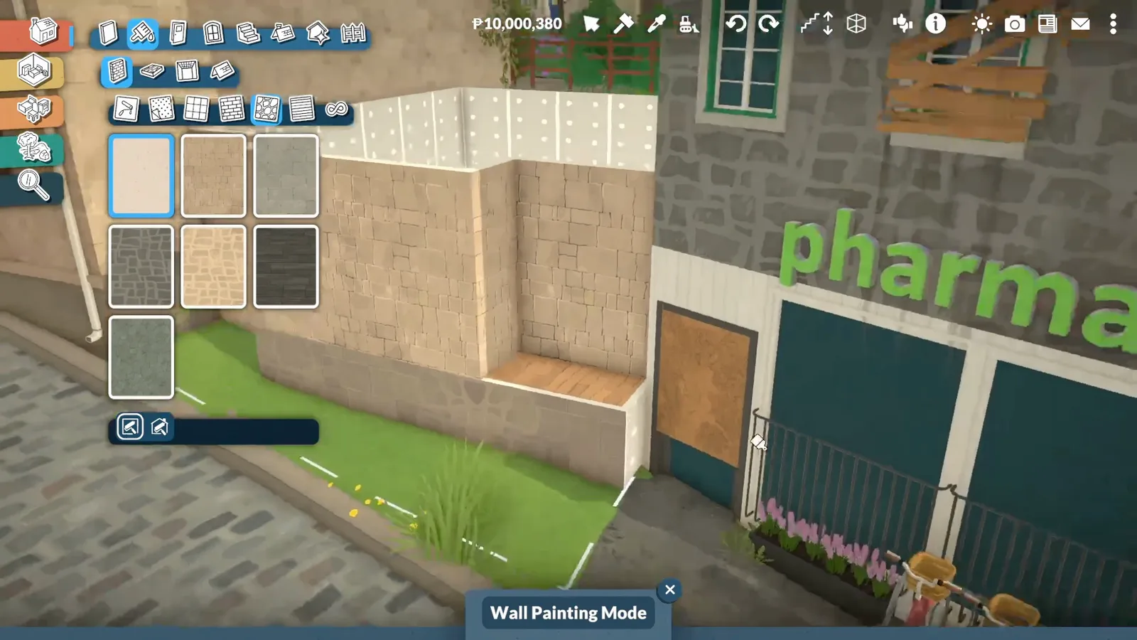 Paralives Wall Painting Mode with sandstone swatches over a bookshop facade beside the green pharmacy sign