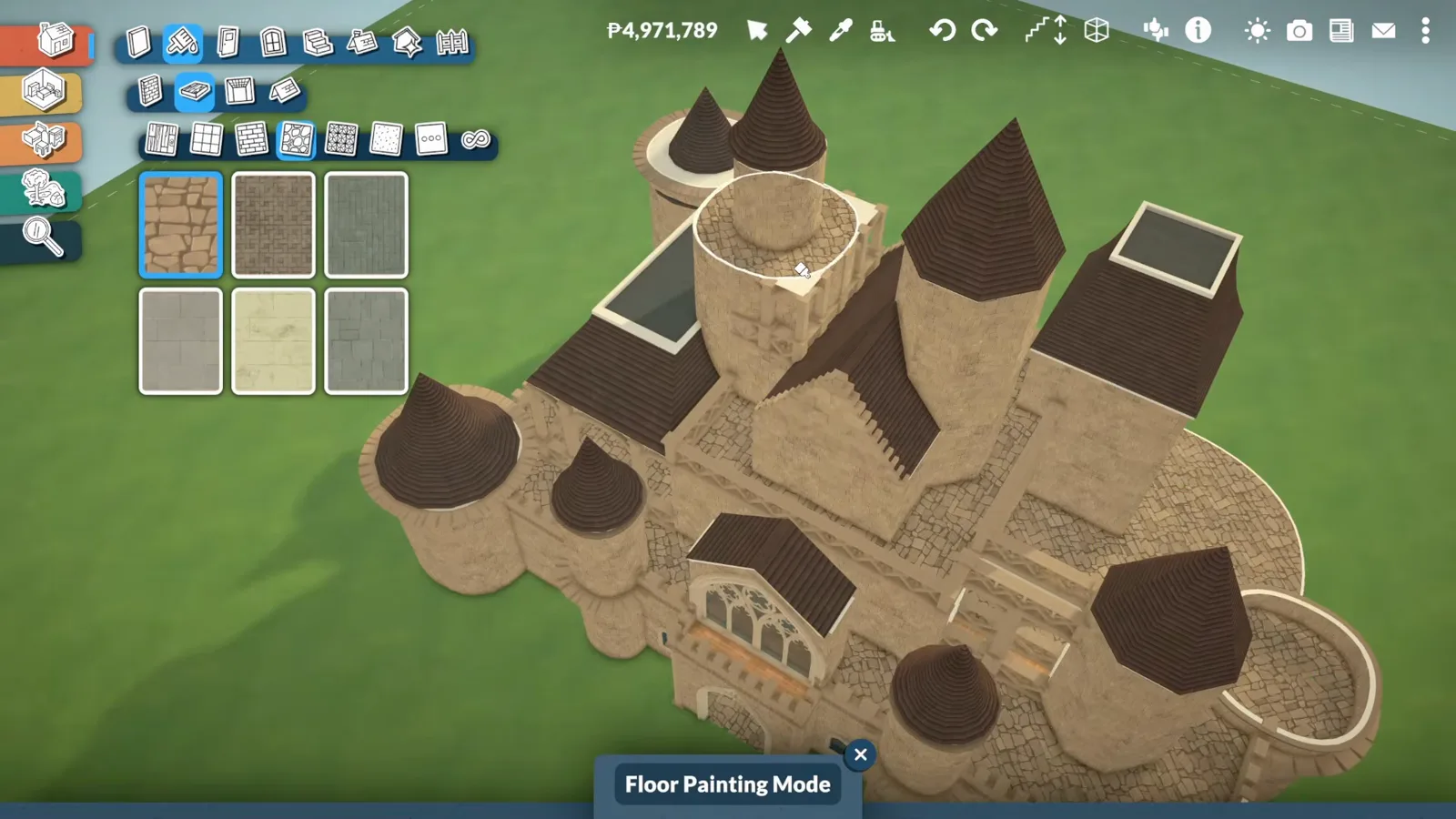 Overhead view of a finished Paralives castle roofline mixing conical turret caps, steep gables and flat roof sections in dark brown