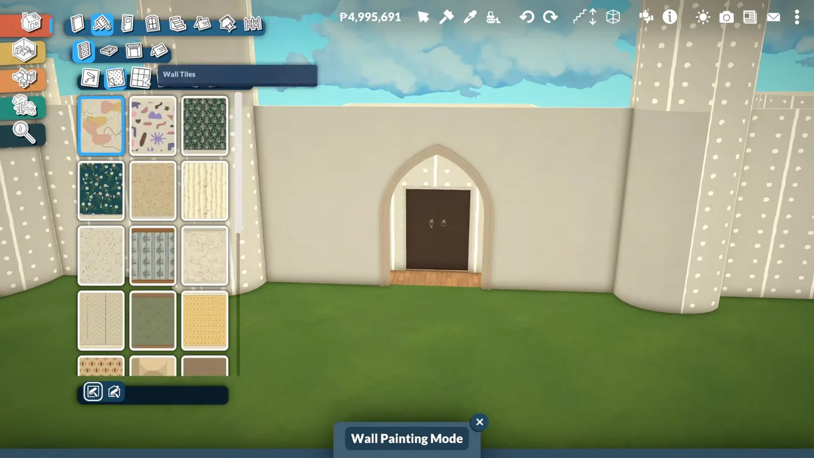 Paralives Wall Painting Mode material palette open beside a white castle curtain wall with an arched wooden gate door set in the opening