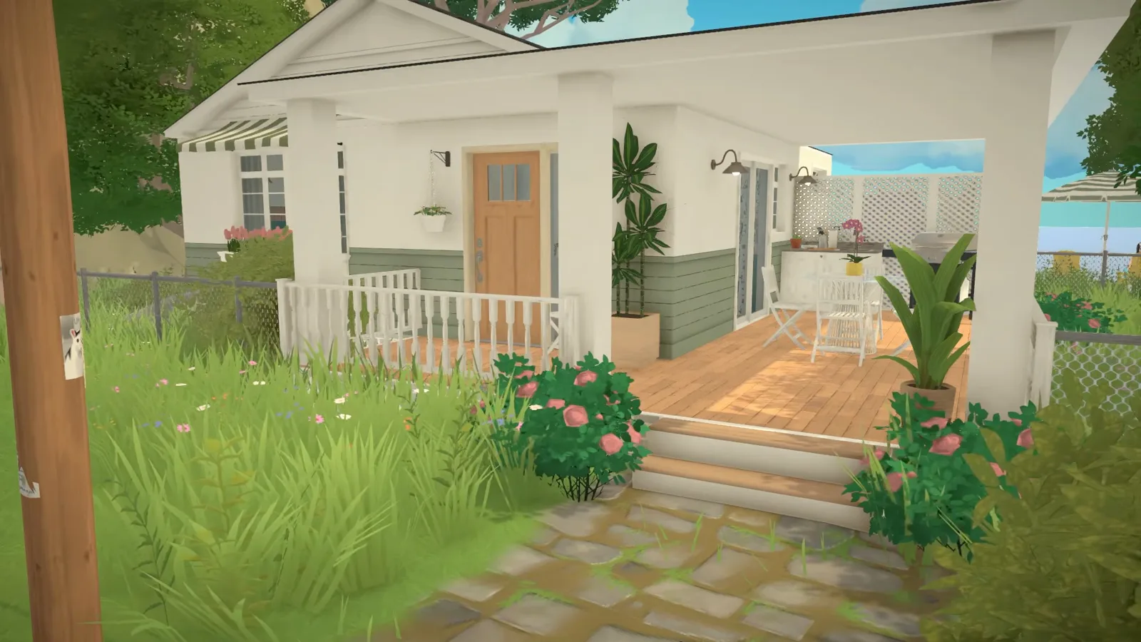 Finished Paralives coastal bungalow with striped awning, window flower box and the ocean behind the porch