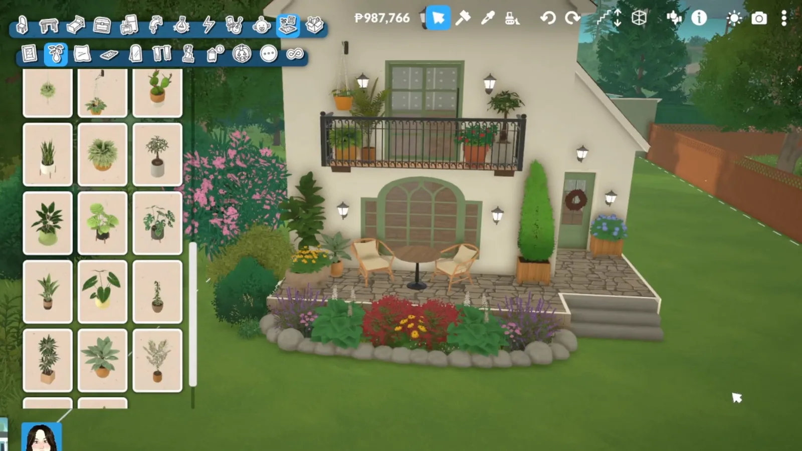 A finished white Paralives cottage with a steep red roof, a black-railed balcony with flower boxes and a full front garden, seen from the lawn A finished white Paralives cottage with a steep red roof, a black-railed balcony with flower boxes and a full front garden, seen from the lawn