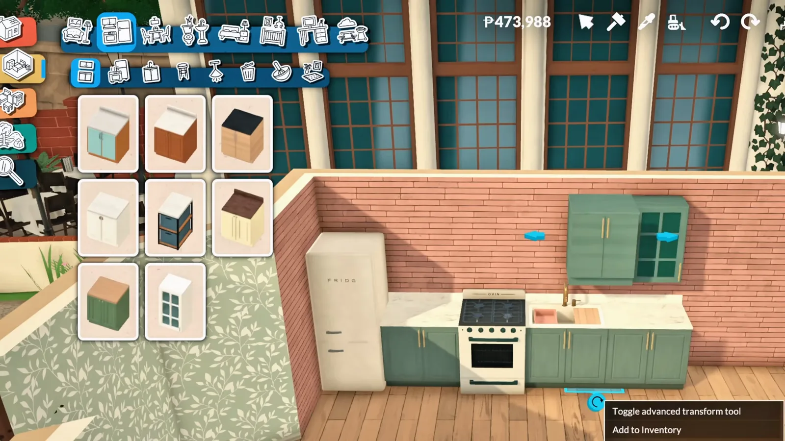 Toggle advanced transform tool tooltip open on custom green kitchen cabinets in Paralives build mode