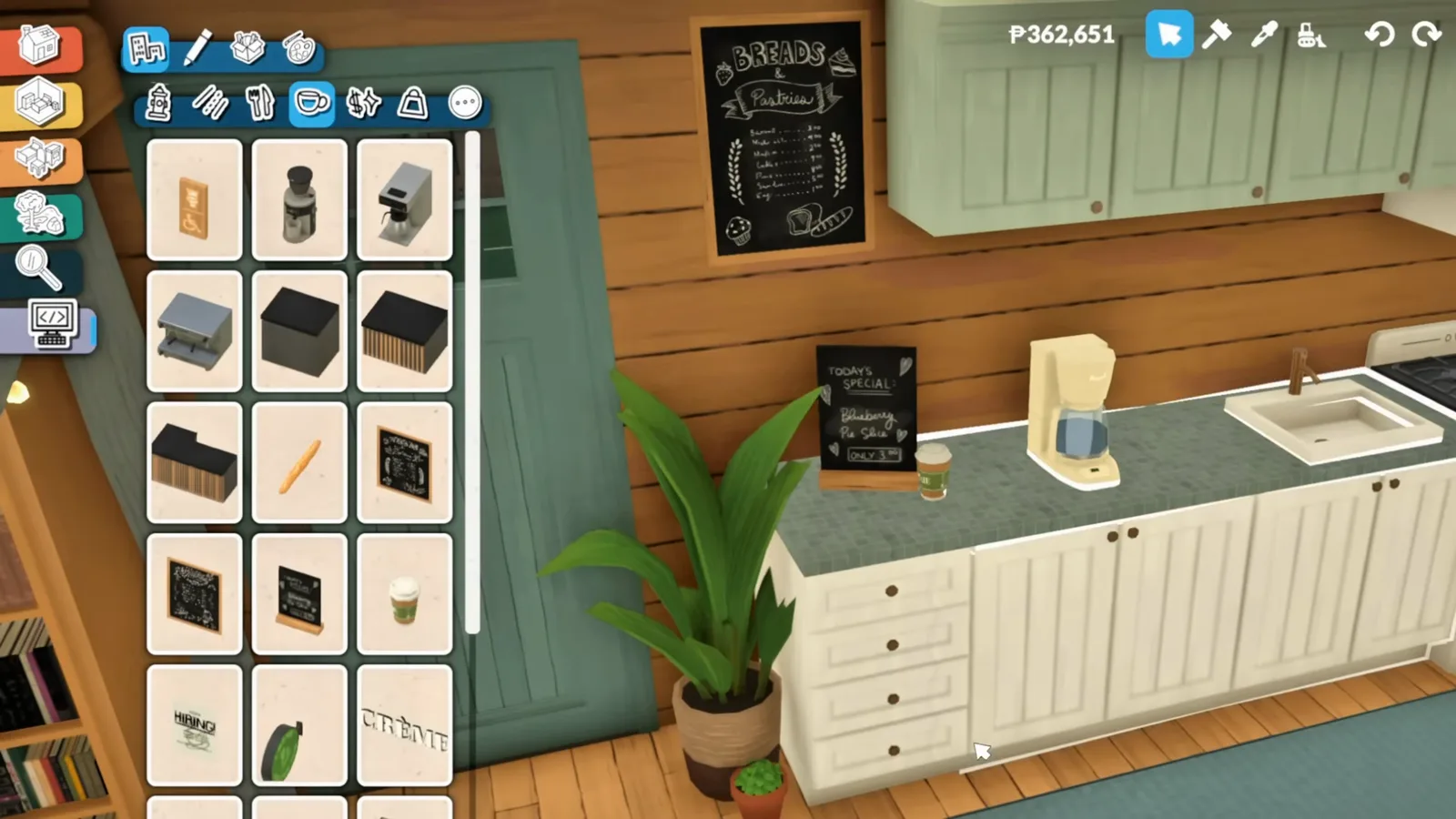 Hidden café objects in the Paralives debug category with chalkboard menu boards selected beside a placed coffee machine and counter Hidden café objects in the Paralives debug category with chalkboard menu boards selected beside a placed coffee machine and counter