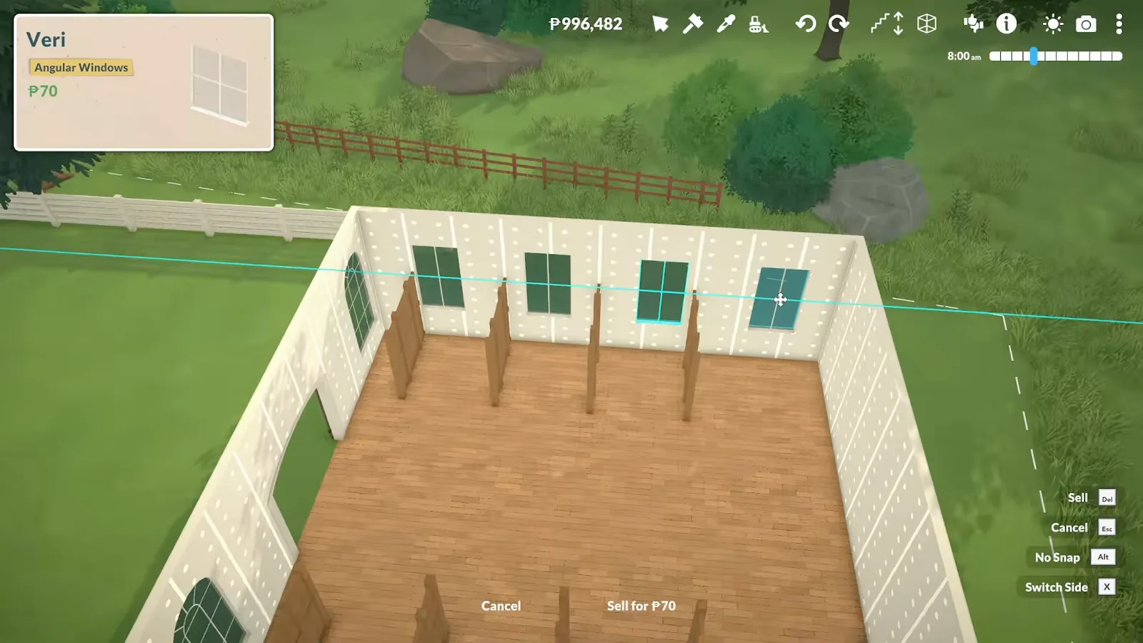 Inside a Paralives barn with wooden partition walls forming cattle stalls along both sides Inside a Paralives barn with wooden partition walls forming cattle stalls along both sides