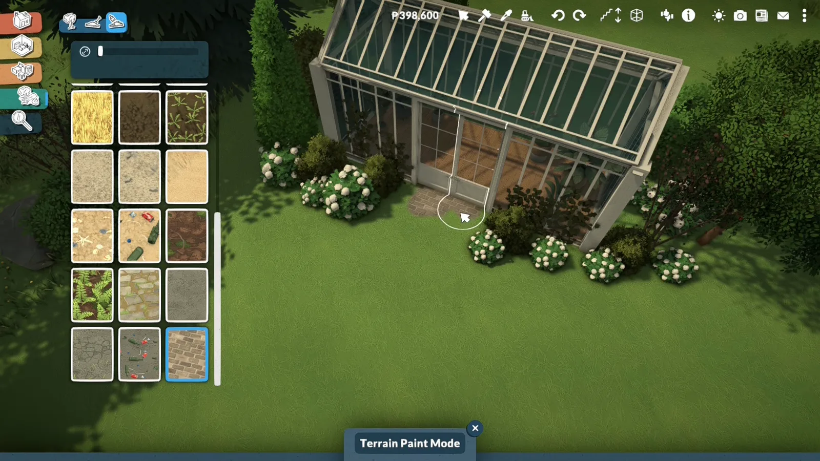 Paralives Terrain Paint Mode brushing a brick paver surface from the terrain palette onto the ground in front of a greenhouse door Paralives Terrain Paint Mode brushing a brick paver surface from the terrain palette onto the ground in front of a greenhouse door