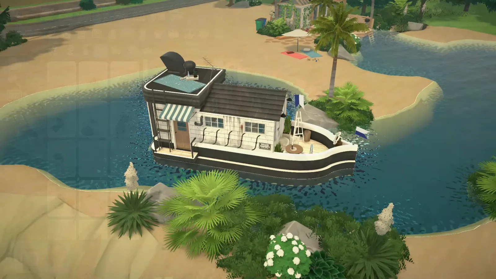 The finished black-and-white Paralives houseboat moored in a sandy cove with a striped awning, flags and a furnished deck The finished black-and-white Paralives houseboat moored in a sandy cove with a striped awning, flags and a furnished deck