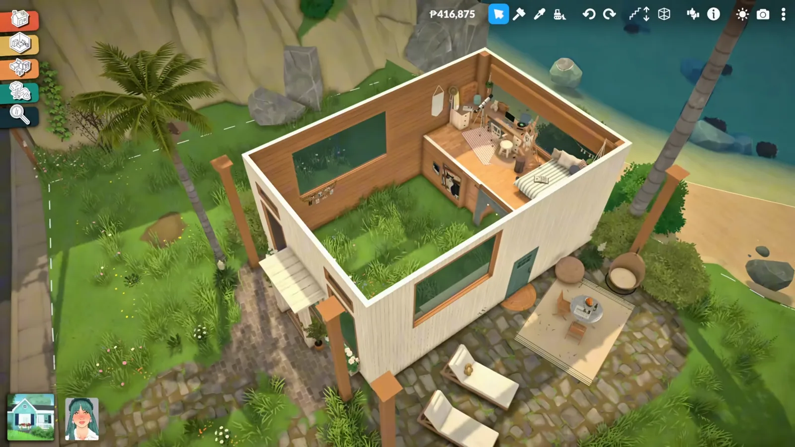 An aerial cutaway of a finished white Paralives loft house with a mezzanine inside and a patio with loungers.