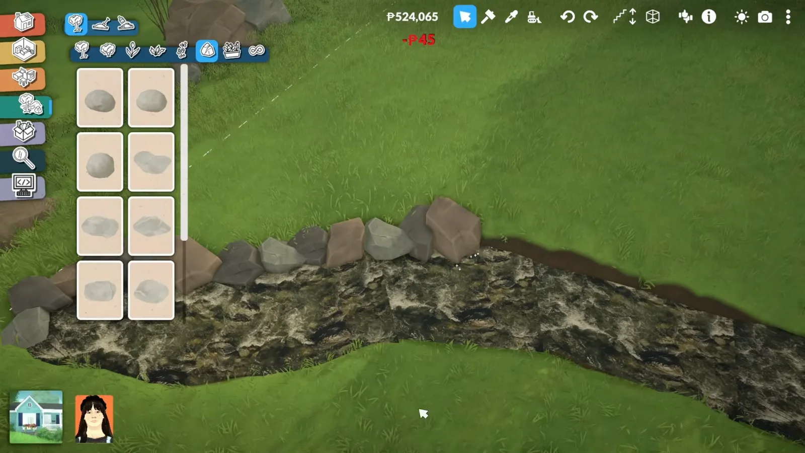 Grey rocks placed along both banks of a Paralives stream rug with the rock catalogue open on the left of the screen.