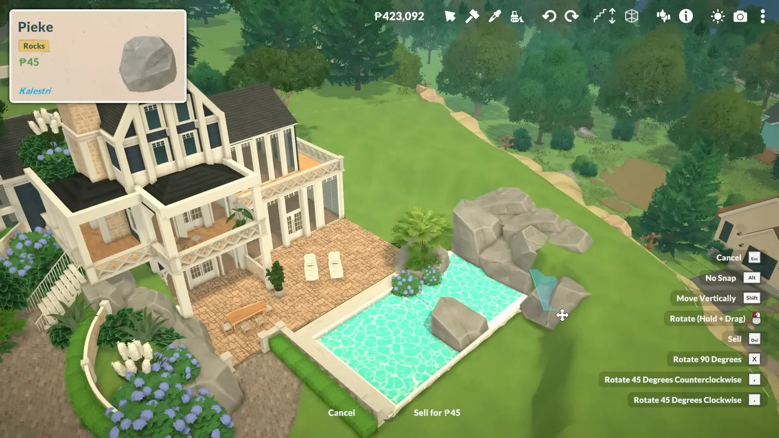 Paralives mansion garden with a turquoise fake pool basin and a rock item selected from the catalogue