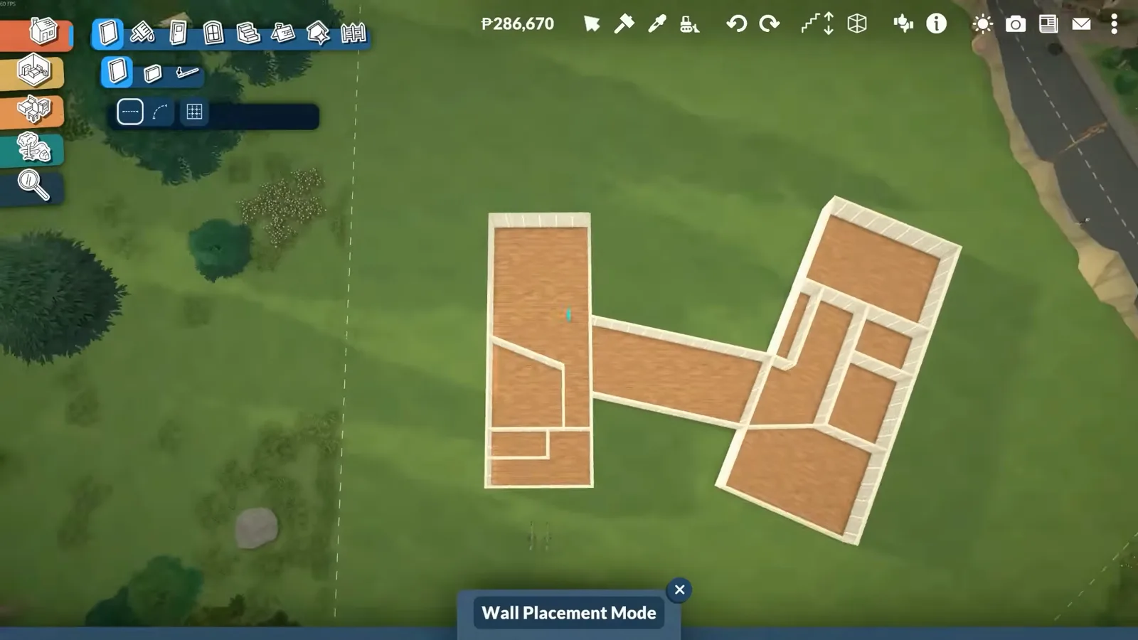 In Paralives Wall Placement Mode, a top-down floor plan shows two finished wings joined by a central spine with wood floors already laid. In Paralives Wall Placement Mode, a top-down floor plan shows two finished wings joined by a central spine with wood floors already laid.