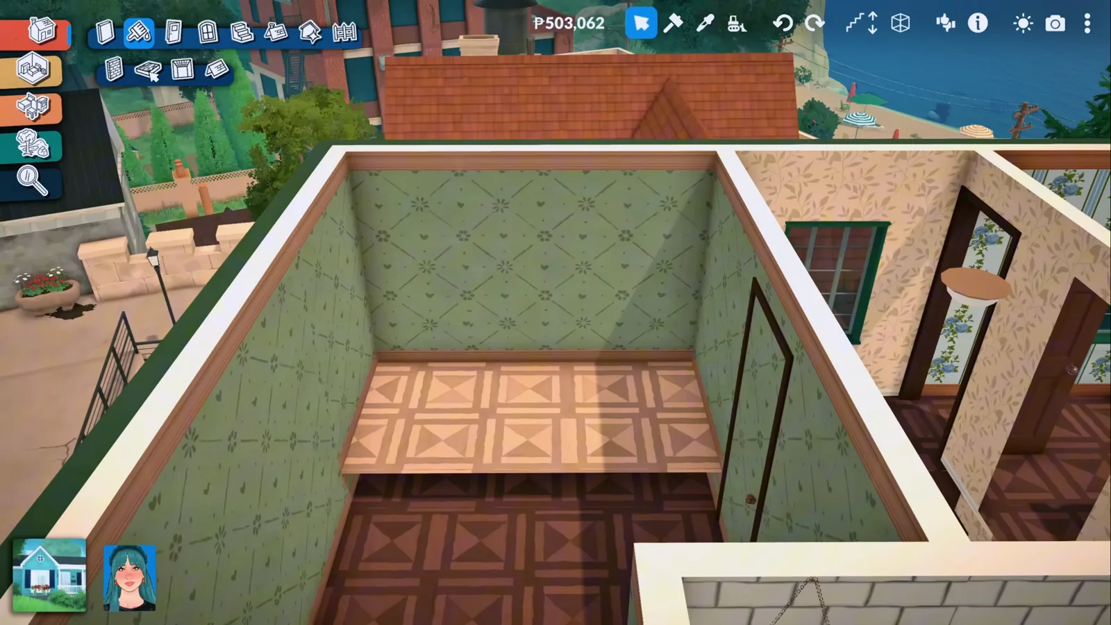 A pale patterned platform floor slab raised inside a green-papered Paralives room, contrasting with the dark parquet floor around it in build mode.