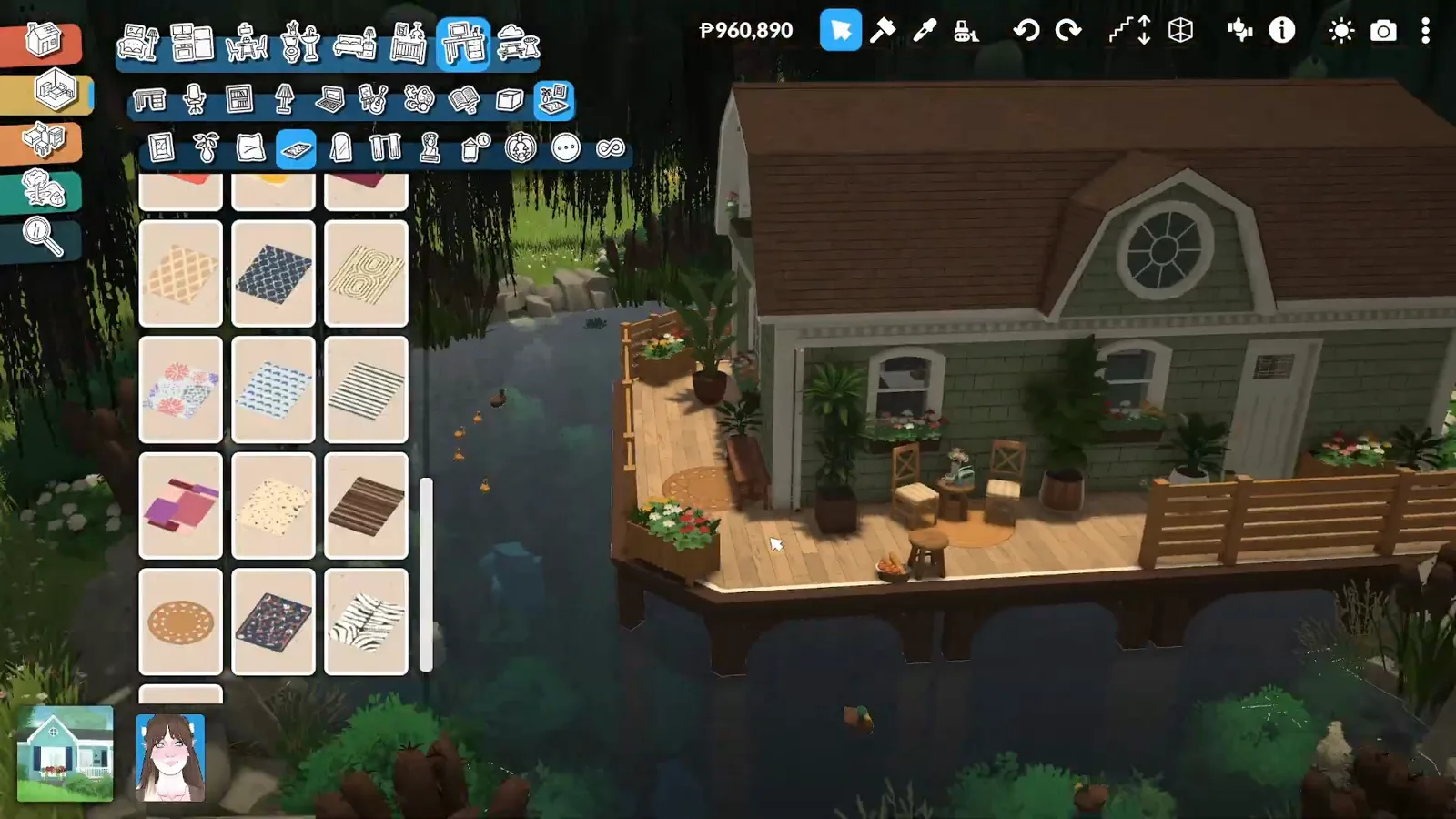 Finished Paralives garden pond with dark reflective water, rock banks and a deck outside a small cottage Finished Paralives garden pond with dark reflective water, rock banks and a deck outside a small cottage