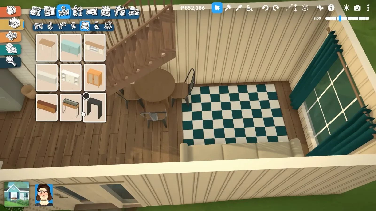 Teal and white checker rug beside a cream couch with a round dining table tucked under the wooden staircase in a Paralives container living room.