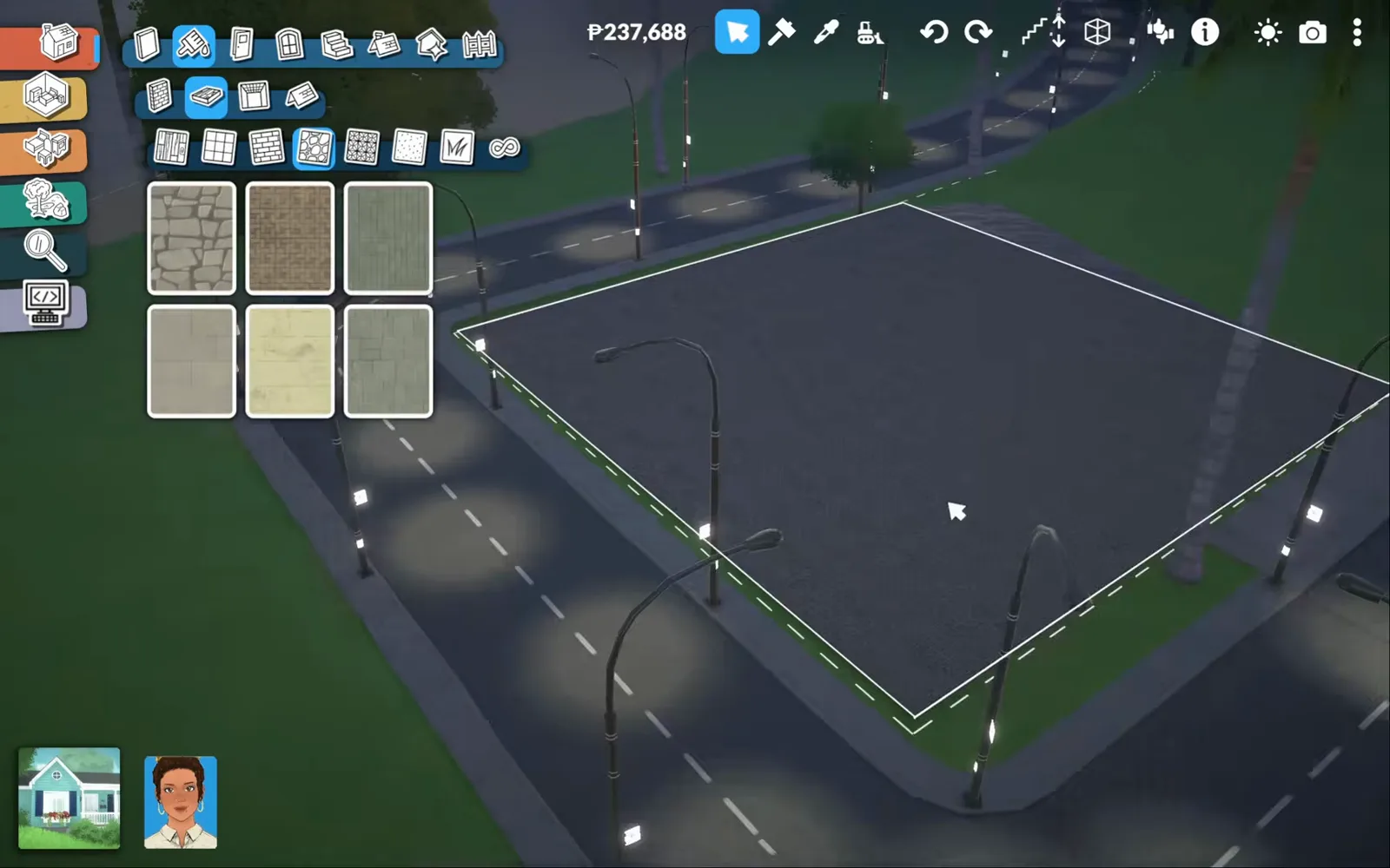 Paralives flooring catalogue with pavement materials open over an empty corner lot at night, the whole future sales floor already paved dark