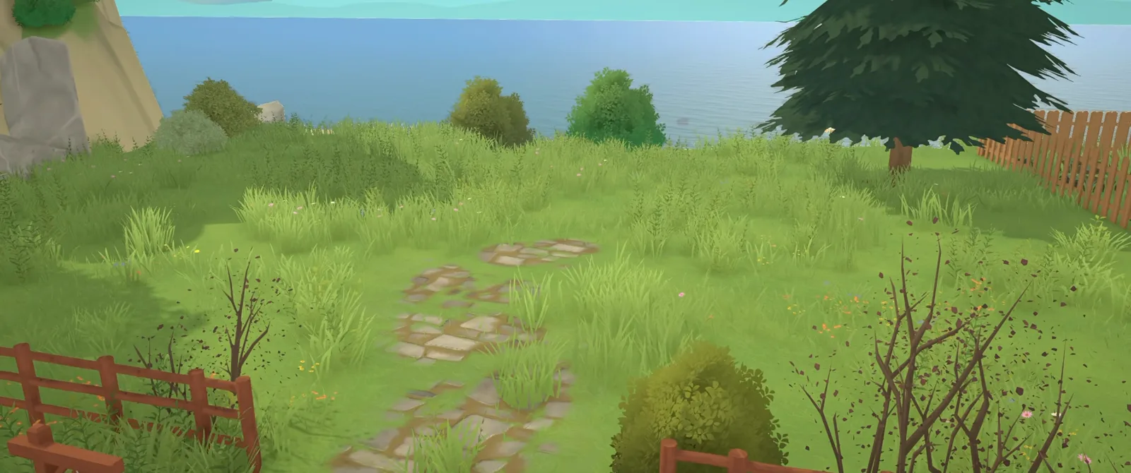 The empty Paralives clifftop lot before building starts, with the beach below on one side and the street fence on the other.