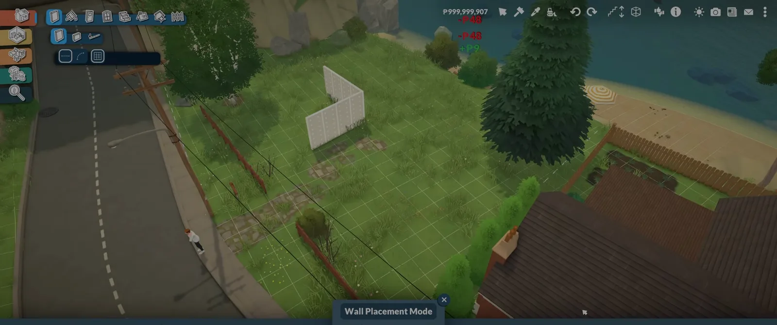 Paralives Wall Placement Mode laying the first wall run across a coastal plot, with the road on the left and the shoreline on the right.